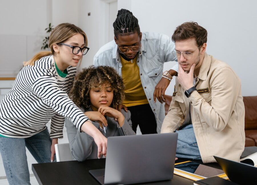 A Group of People Planning while Looking at the Laptop