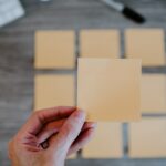 person holding white printer paper